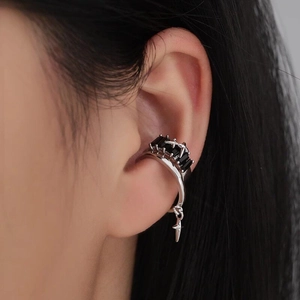 Silver cuff earring featuring black rectangular stones and a dangling star pendant