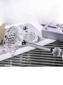 Detail of diamond cut glass candle holder with sparkling crystal filled metal stem