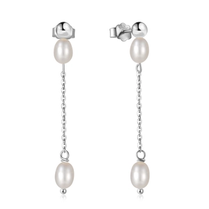 Macro shot of S925 sterling silver stamp and baroque pearl on long tassel earrings
