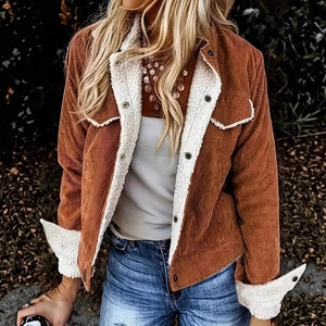 Detail shot of brown corduroy jacket featuring white sherpa fleece lining and collar accents