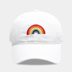 Close-up of rainbow embroidery detail on a premium white cotton baseball cap