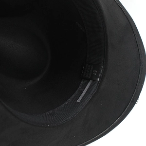 Detailed macro view of black fedora inner band with 100% polyester label and size 57