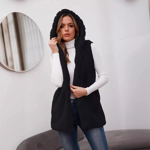 Chic black hooded quilted vest for women styled with casual blue jeans and white sweater