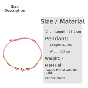 Close-up of pink woven heart bracelet with 18K gold plated copper and zircon stones