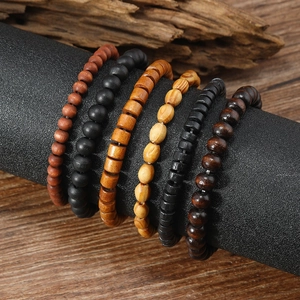 Detail of multi-layer handmade wooden beads and coconut shell bracelets for men