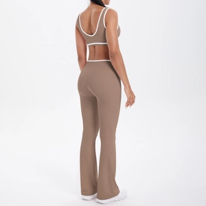 Detail view of mocha yoga set with white trim, featuring flare leggings and sports bra