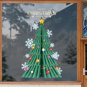 Christmas tree window stickers with green snowflakes and gold ornaments on glass decor