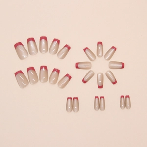 Detailed flat lay of 24pcs coffin French tip press-on nails in nude pink and red