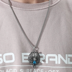 Vintage silver wolf head necklace with blue zircon pendant on a steel box chain
