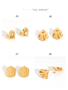 Macro display of four distinct 18K gold pleated stainless steel earring designs