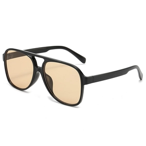 Classic black pilot sunglasses with transparent amber lenses shown at a 45-degree angle