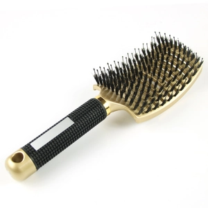 Curved golden hairbrush with boar bristles and ergonomic black non-slip handle