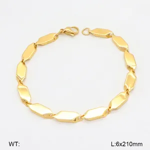Macro detail of gold-plated stainless steel double chain with geometric octagon links