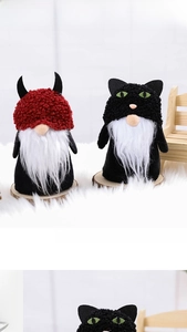 Detailed view of Halloween gnome plush dolls with black velvet and white beards on wood base