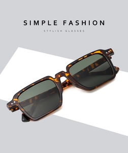 Detail of tortoise shell square sunglasses with dual metal rivets and grey lenses