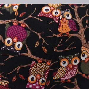 Cotton baseball cap featuring colorful cartoon owl embroidery and detailed fabric texture