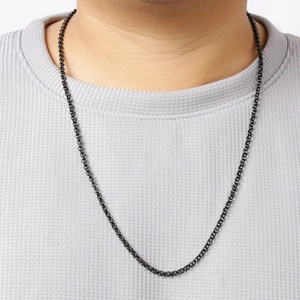 Black stainless steel pearl chain necklace for men and women worn on a gray t-shirt