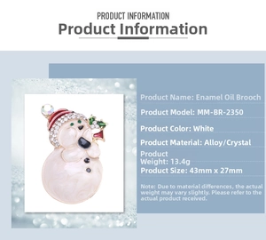 Detail view of snowman brooch showing 43mm by 27mm dimensions and enamel finish
