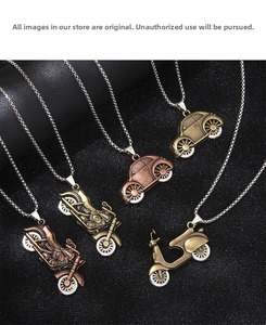 Close-up of vintage metallic motorcycle and beetle car pendants with antique finish
