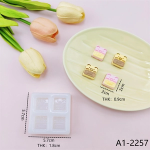 Detailed view of pig silicone mold dimensions with cute pink and yellow resin samples