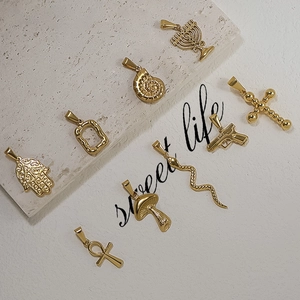 24K gold plated stainless steel pendants featuring snake, cross and mushroom motifs