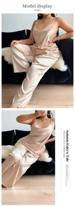 Detail of silk satin two-piece sleepwear set with camisole top and loose trousers