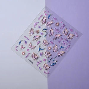 Detail view of 3D embossed butterfly and heart nail stickers with gradient colors
