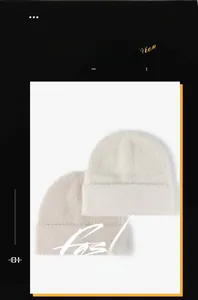 Detail of white and beige feather yarn knitted hats showing soft texture and roll edge