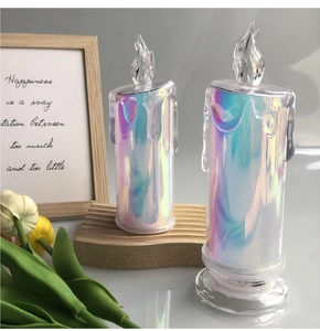 Detailed view of colorful holographic LED electronic candles with wooden frame decor