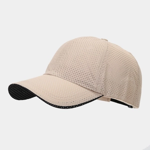 Close-up of breathable mesh fabric and black visor detail on khaki outdoor baseball cap