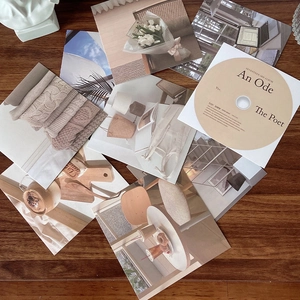 K-pop SEVENTEEN An Ode The Poet album set with CD and photo cards on a wooden table