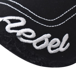 Detailed close-up of white rebel embroidery on high-quality black cotton baseball cap