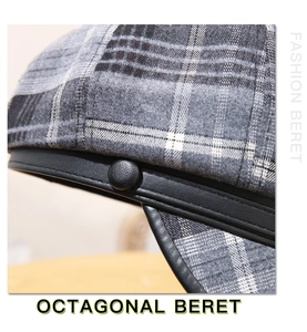 Detail of wool octagonal beret featuring grey plaid fabric and black leather trim decor