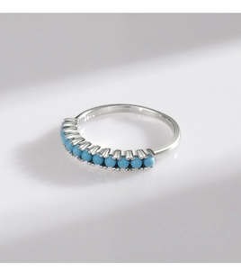 Detailed macro view of S925 sterling silver ring featuring eleven turquoise beads set in a row