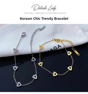Detailed macro view of heart-shaped stainless steel link bracelets in gold and silver finish