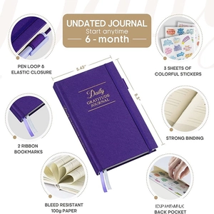 Detail view of purple linen gratitude journal with pen loop, strap, and 100g ink-proof paper