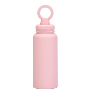 Close-up of pink stainless steel water bottle with ring handle lid on white background