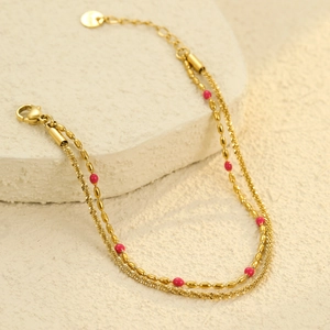 Detail of 18K gold stainless steel layered bracelet with pink beads on stone
