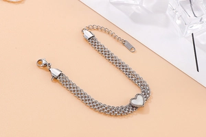 Detail of multi-strand stainless steel heart bracelet with lobster clasp and S.STEEL stamp