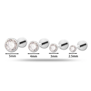 Titanium labret and tragus studs with round zircons in 2.5mm to 5mm sizes on white background