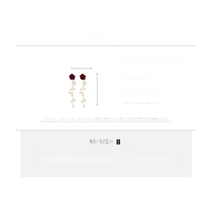 Close-up of long velvet rose earrings with white pearl tassels and size dimensions