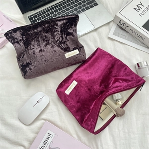 Top view of velvet makeup bags showing soft texture and spacious storage for cosmetics