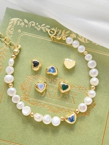 Detail of 14k gold plated heart charms with colorful zircons for DIY bracelet jewelry