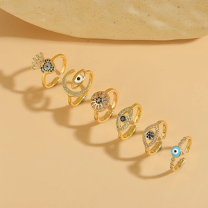 Set of six gold-plated Evil Eye rings with blue zircon and crown heart design