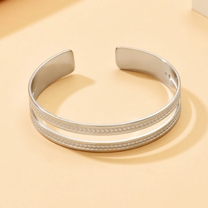 Minimalist silver double-layered open bangle with beaded trim and adjustable cuff design
