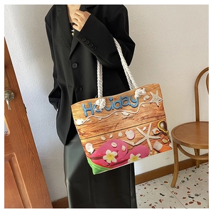 Detail of canvas tote bag with holiday beach print and durable thick rope handle