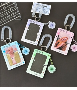 Detail of glitter acrylic card holders with clover charms and spring wrist lanyards