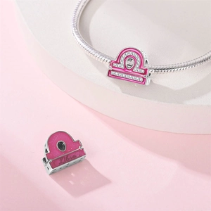 Detail of pink enamel Libra charm with cubic zirconia for DIY bracelets