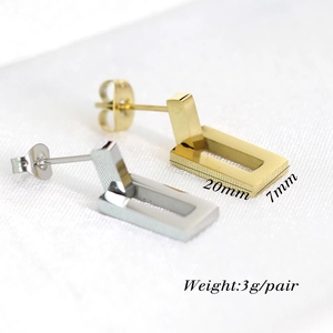 Detail view of 20mm x 7mm hollow rectangular stud earrings in gold and silver finish