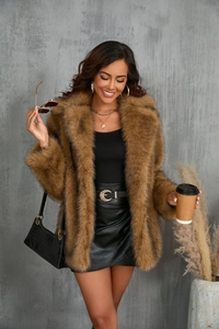 Close-up of brown faux fur coat with oversized collar and long sleeves for women
